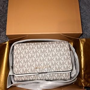 Women’s brand new still in original box Michael Kors bag.